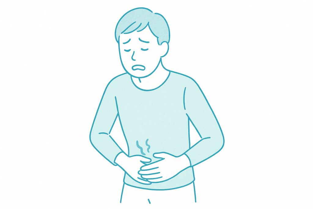 腹痛でお腹を押さえて苦しそうな表情をしている人物のイラスト